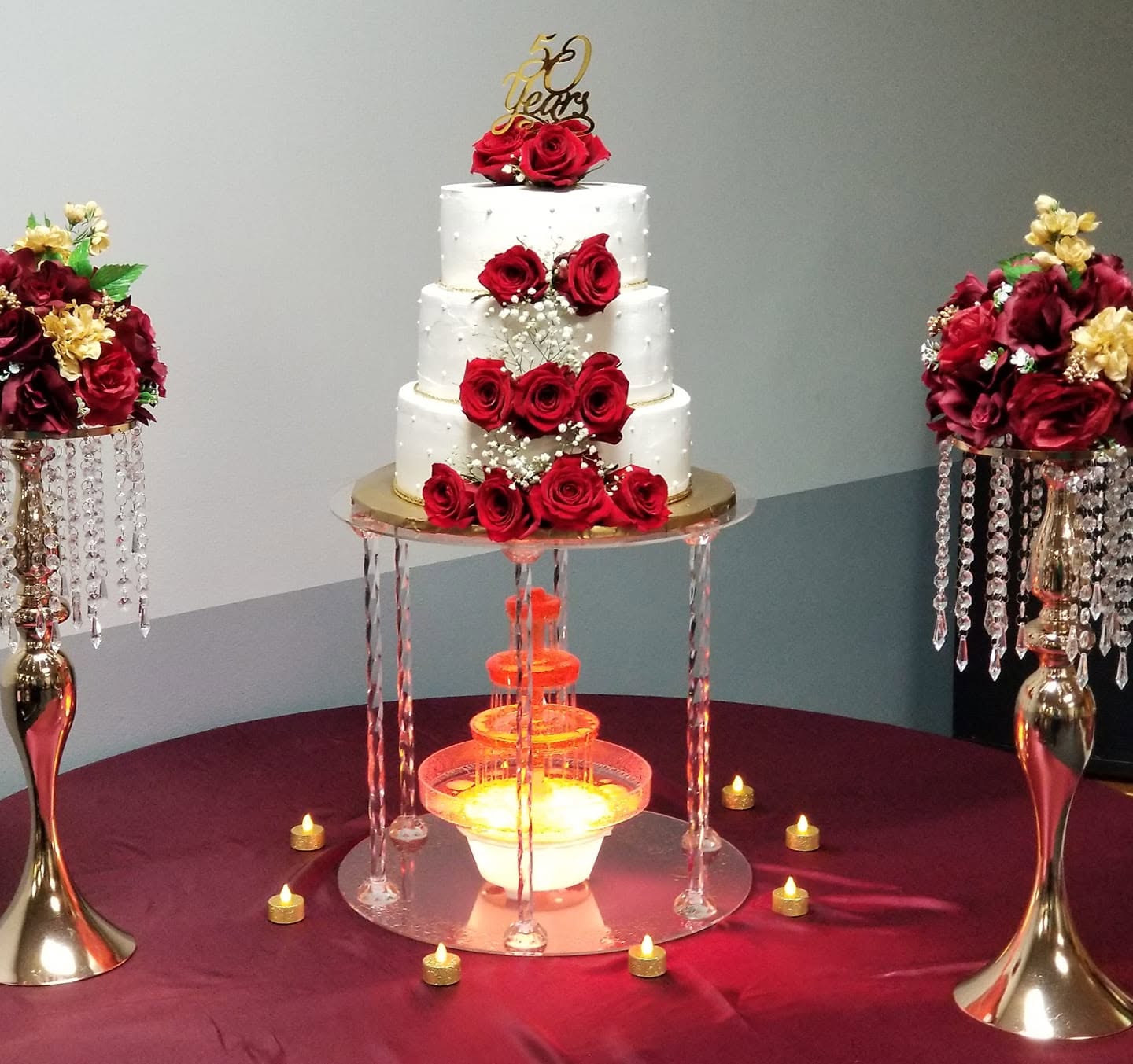 3-tier anniversary cake on crystal stand