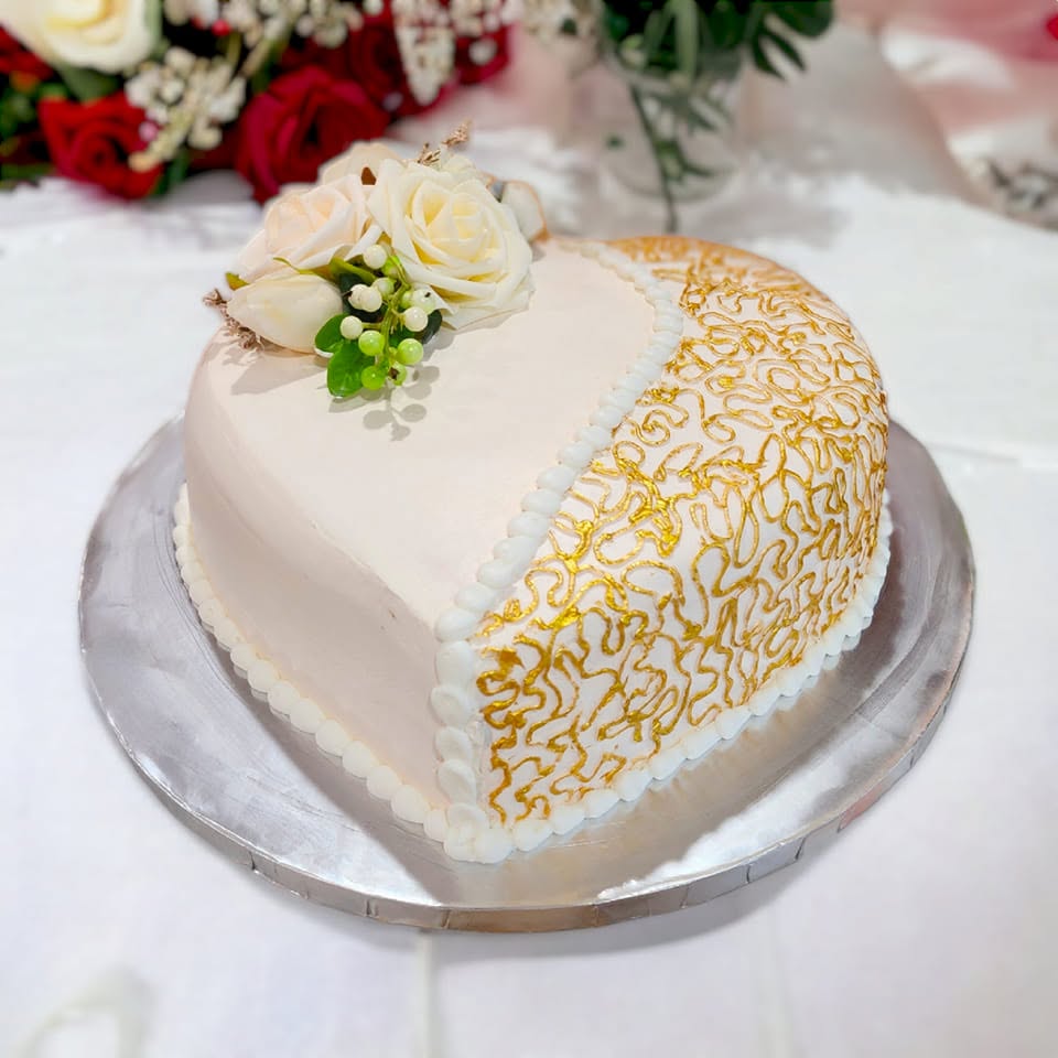 Heart-shaped gold lace wedding cake