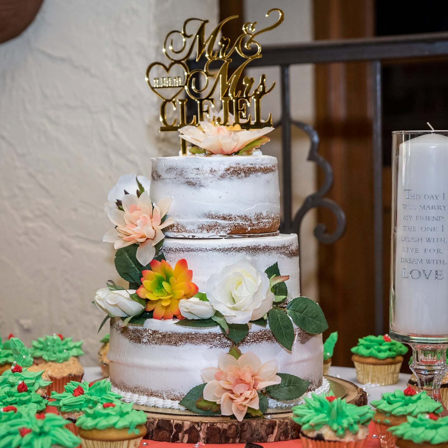 Mr & Mrs Clejel naked wedding cake with florals